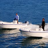 Mootorpaat Poseidon Fish 4.99 M keskonsooliga isetühjenev